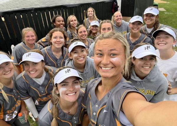 smiling softball team selfie